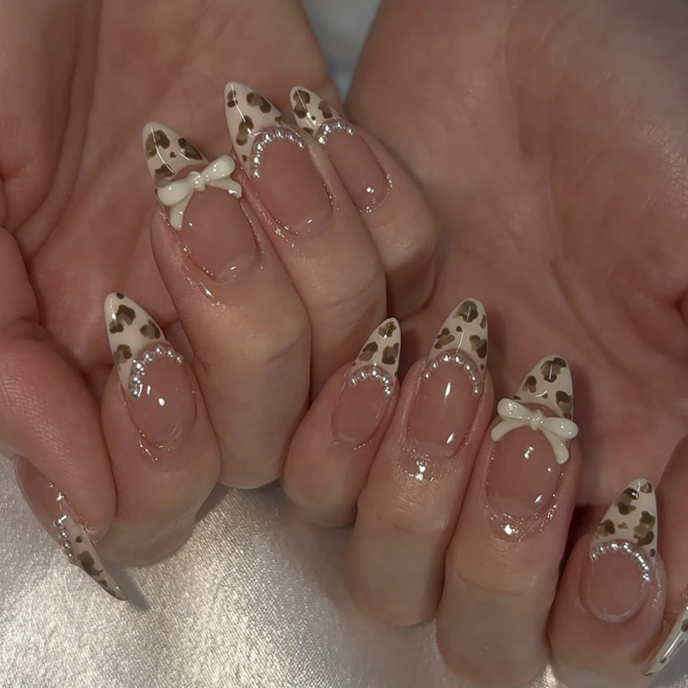 Posyofet almond French tip nails with leopard print and bow for polished elegance.