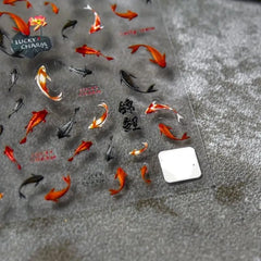Powpop goldfish lotus nail decal adds elegant detail to at-home manicures