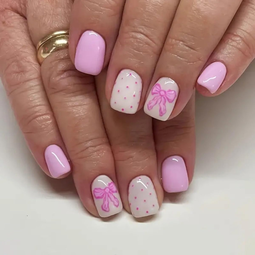Powpop pink press-on nails with heart design for salon-like at-home manicure.