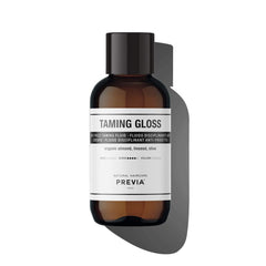 PREVIA Anti-Frizz Gloss bottle offers silky hydration and frizz control.