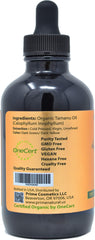 Close-up of PRIME NATURAL Tamanu oil amber bottle highlighting purity and organic certification.