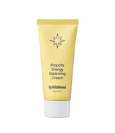 BY WISHTREND Propolis Energy Balancing Cream bottle pour supports lightweight hydration.
