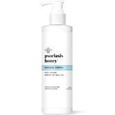 PSORIASIS HONEY Renewing Shampoo bottle pouring for refreshed scalp hydration.