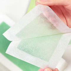 Pumei wax strips held taut and pulled opposite growth.