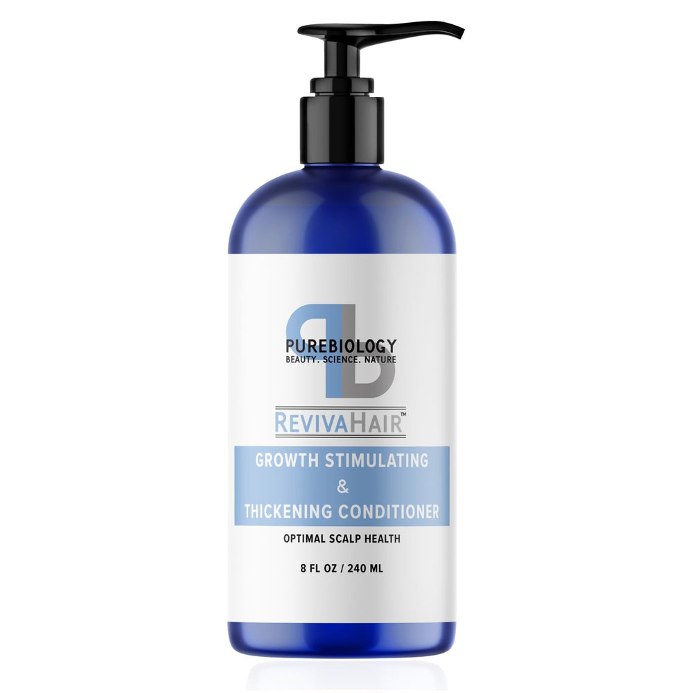 Pure Biology hair conditioner bottle close-up showing volumizing formula for fine and damaged hair