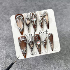 Qicaijia embossed swirl design nails add tactile luxury and shimmer