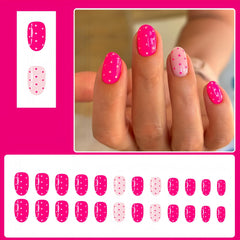 Quezadyl pink polka dot nails in short oval shape for a quick manicure