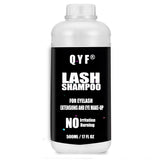 QYF Eyelash Extension Shampoo bottle with dual caps for secure storage and hygiene.
