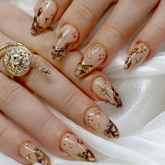 QZRUO Gold Almond Press On Nails with 3D chrome finish for chic elegance.