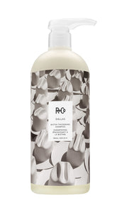 R+Co Dallas Thickening Shampoo bottle pour for fuller-looking hair.