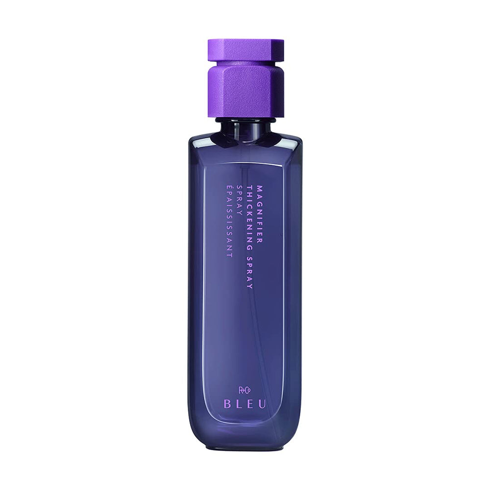 R+Co Magnifier thickening spray bottle for volumized hair throughout the day.