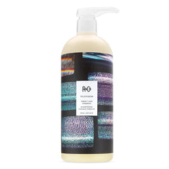 R+Co Television Conditioner bottle highlighted beside the shampoo for balance.