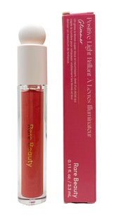 Rare Beauty Glimmer pour les lèvres — bouteille lumineuse et reflets rose doré, hydratation rapide.