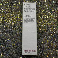 Rare Beauty Liquid Touch Brightening Concealer cream texture highlights hydration and smooth skin.