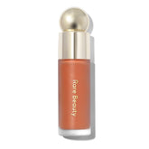 Rare Beauty Soft Pinch Joy bottle close-up for weightless, long-lasting color.