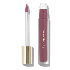 Rare Beauty Stay Vulnerable lip balm tube in nearly mauve for hydrating shine.