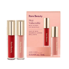 Rare Beauty Stay Vulnerable mini gloss lip balm Nearly Petal delivers soft pink shine and hydration.