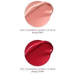 Rare Beauty Stay Vulnerable mini gloss lip balm Nearly Scarlet provides bold red color with weightless comfort.