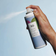 R+Co Balloon texturized hair after spray demonstrates texture.