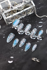 Rdntbeu solid chrome tips on nails add a luxurious accent for evening looks.