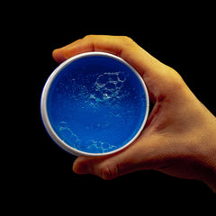 Redone Blue Wax Slick-Back highlighting sleek edge with flexible hold