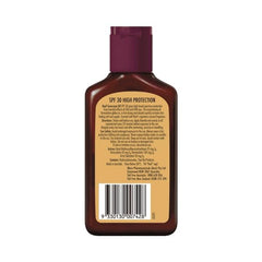 Reef Dark Sun Tan Oil Coconut in action shows smooth application and non-sticky feel