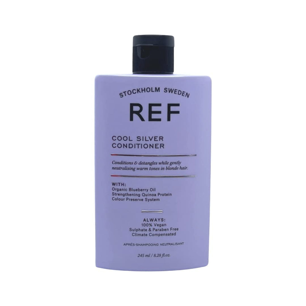 REF Cool Silver Conditioner bottle pour showing violet pigments to neutralize yellow tones.