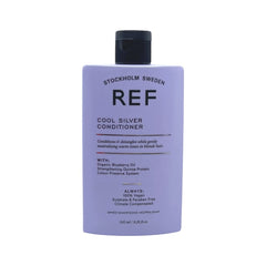 REF Cool Silver Conditioner bottle pour showing violet pigments to neutralize yellow tones.