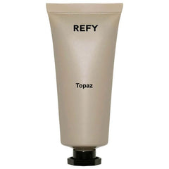 REFY Body Glow Highlighting Serum bottle pour for hydrating radiance.