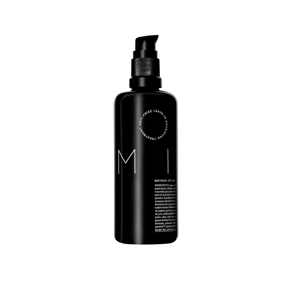 REVERIE Natural Milk anti-frizz bottle closeup shows frizz control.