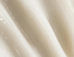 REVERIE Natural Milk anti-frizz leave-in pump demonstrates easy application.