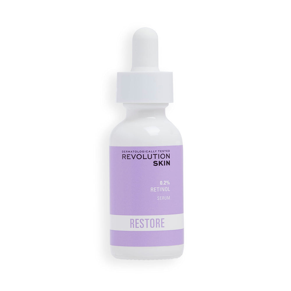 Revolution Skincare London 0.2% Retinol Serum bottle on a vanity, supporting smoother skin texture.