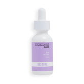 Revolution Skincare London 0.2% Retinol Serum bottle on a vanity, supporting smoother skin texture.