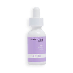 Revolution Skincare London 0.2% Retinol Serum bottle on a vanity, supporting smoother skin texture.