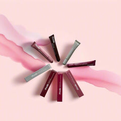 Lips wearing Rhode Gloss Lip Tint showing translucent color and natural shine.