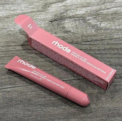 Rhode Peptide Lip Tint Salty Tan being applied for a hydrated glossy lip.