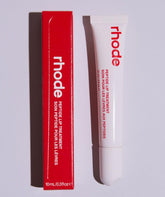 Rhode Peptide Lip Treatment Strawberry Glaze bottle delivers glossy hydration.