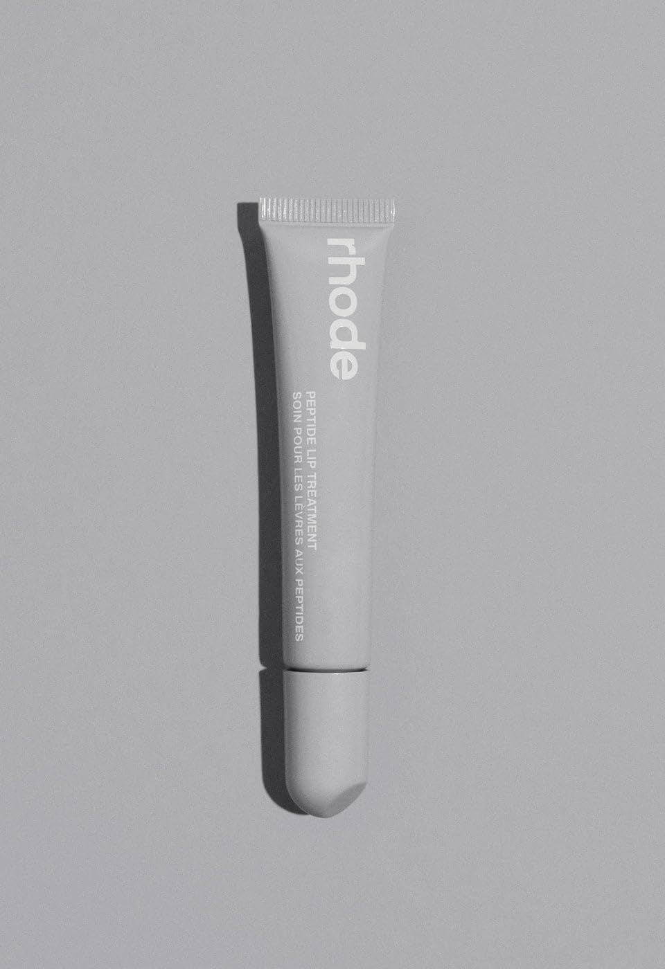 Rhode Unscented Lip Treatment bottle with cushion applicator for daily hydration and gloss