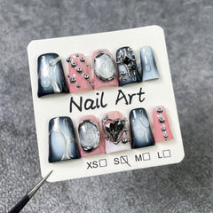 RIICFDD nail kit featuring glue, cuticle stick, and travel pouch