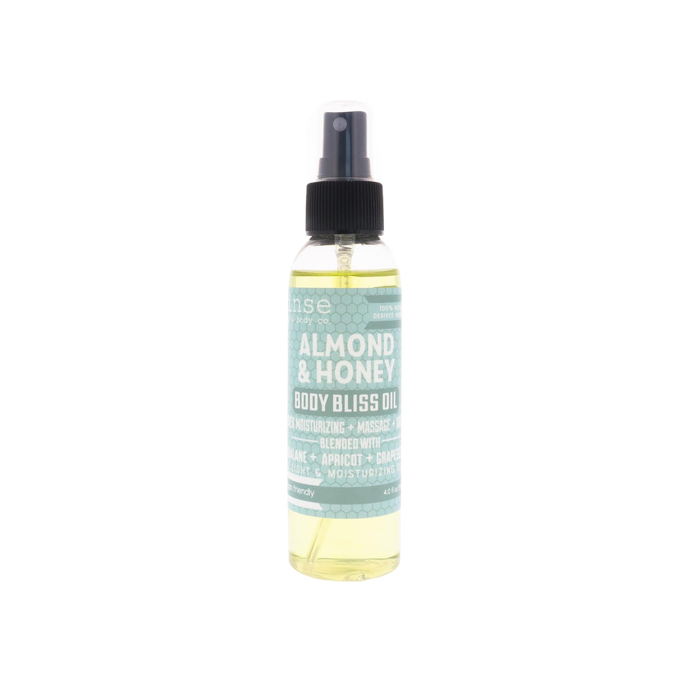 Rinse Almond & Honey body oil spray bottle shows quick-absorb formula for all skin types
