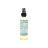 Rinse Almond & Honey body oil spray bottle shows quick-absorb formula for all skin types