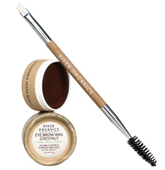 Bamboo brush applies River Organics Chestnut wax for precise brow shaping.