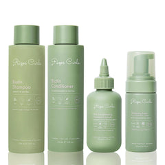 Rizos Curls Lengthening Oil bottle pouring for smooth application and longer-looking hair routine.