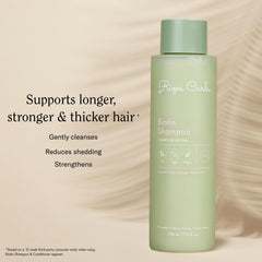 Rizos Curls Biotin Shampoo with rosemary oil; promotes shine and softness.