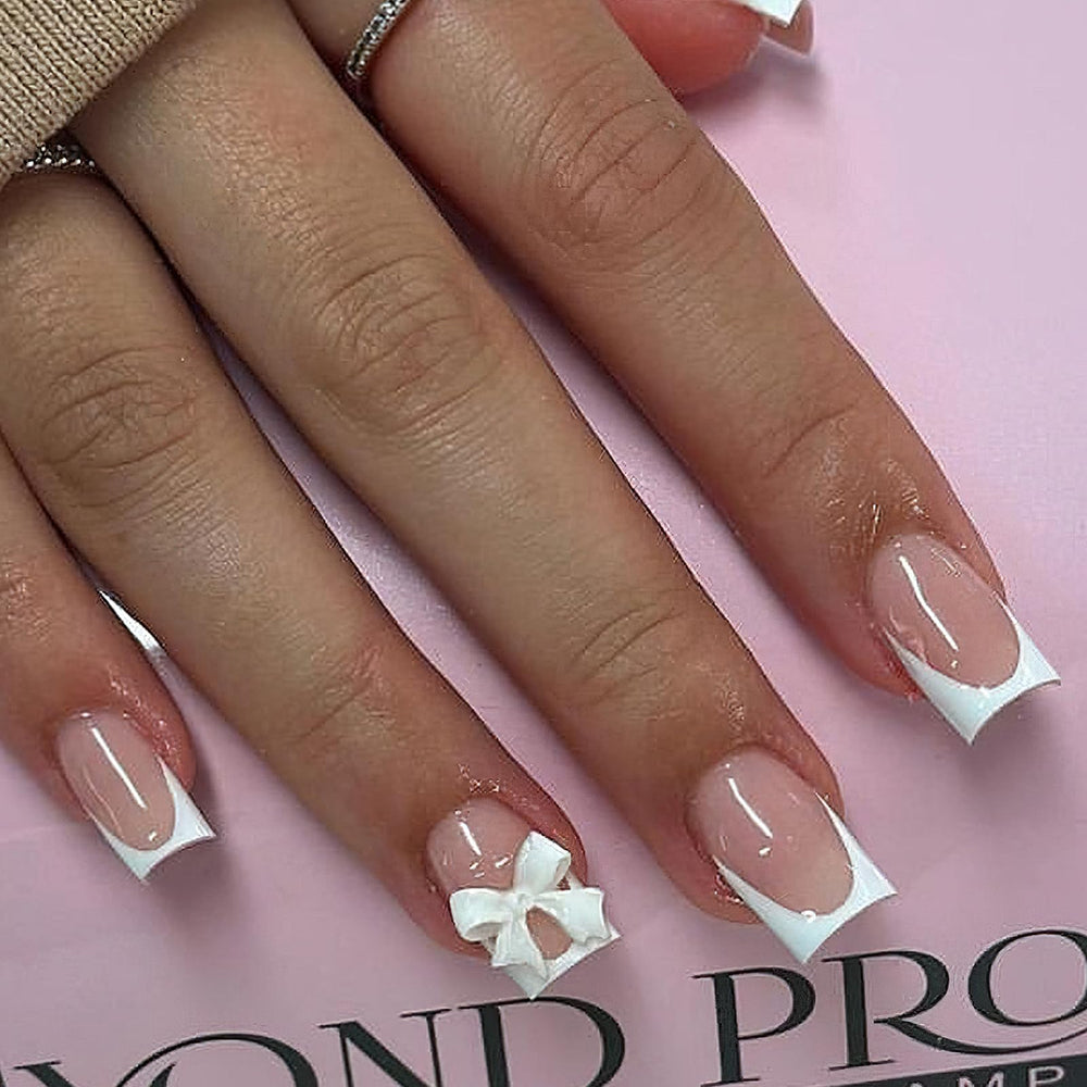 ROFIBUT white bow nails with glossy finish for quick home manicure.