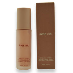 Rose Inc Radiant Reveal serum in hand conveying hydration and glow.