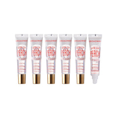 Ruby Kisses Broadway Vita-Lip gloss peach swatch showing vibrant shine