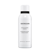 SACHAJUAN Dark Dry Powder Shampoo being sprayed on dry roots for quick refresh.