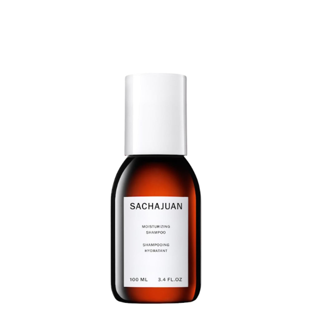 SACHAJUAN Moisturizing Shampoo bottle pouring for hydrating and frizz control.