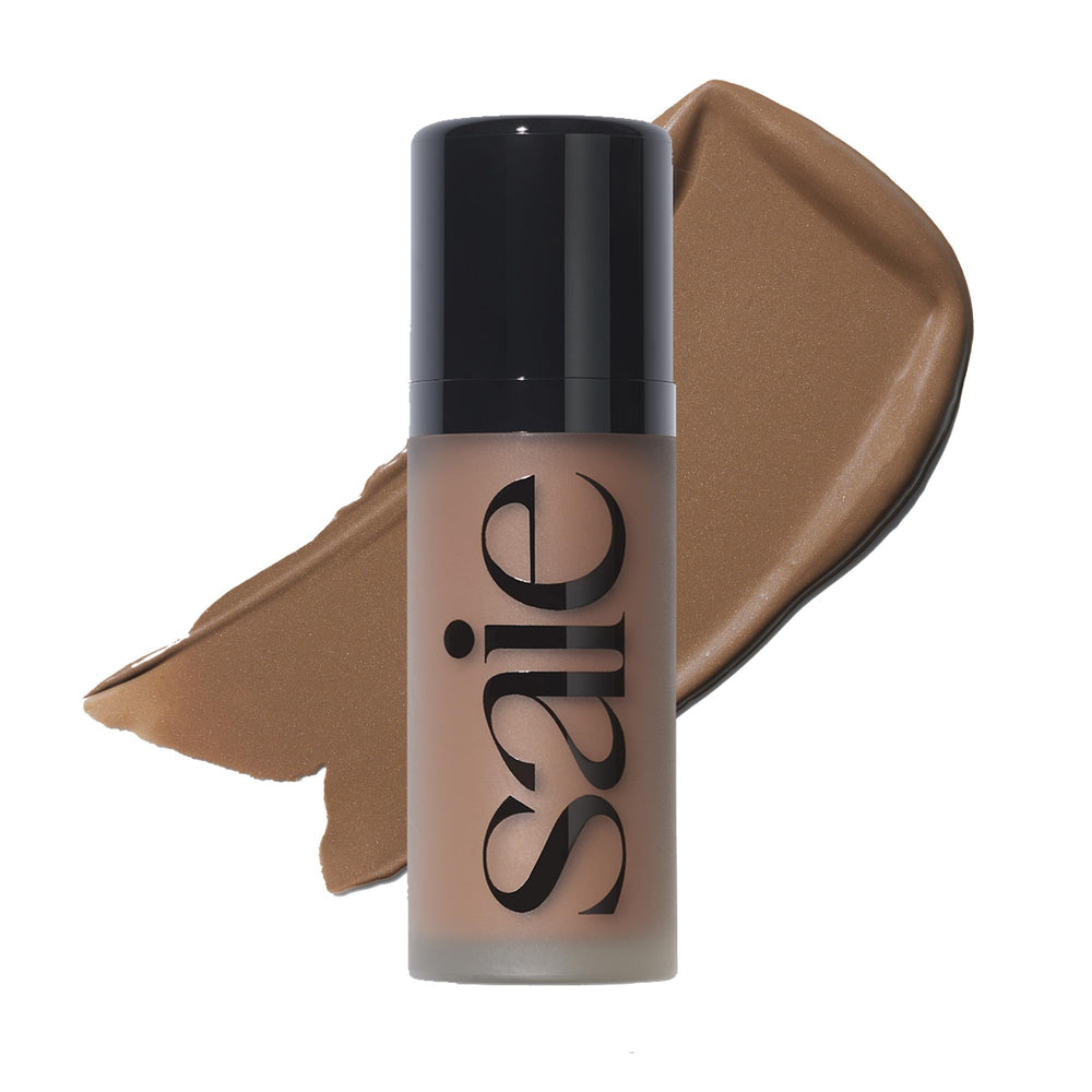 Saie Dew Bronze Salt bottle closeup showing hydrating bronzer packaging for everyday glow.